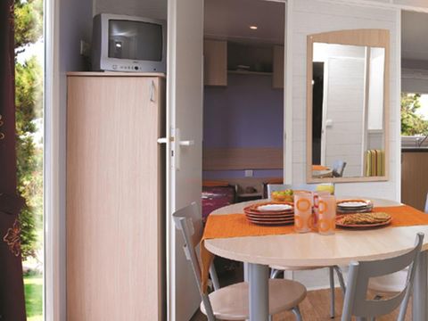 MOBILHOME 4 personnes - Cottage Louisiane - 2 chambres : 31m² - Terrasse semi-couverte 15m² 4 pers.