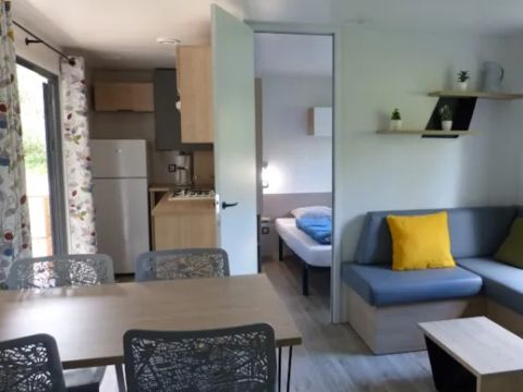 Mobilhome 2/6 personnes - Premium 32m² - 3 chambres - Terrasse semi-couverte - TV - Clim