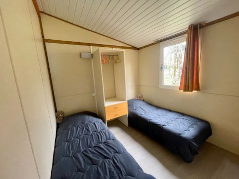 Chalet 4 personnes - Peuplier Standard 26m² - 2 chambres - Terrasse couverte 10m² - Clim - TV