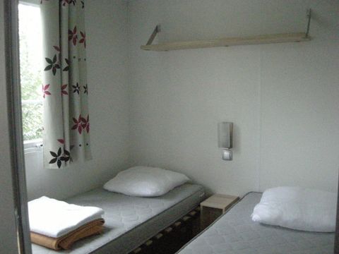 MOBILHOME 4 personnes - CONFORT 25m² - (4pers) - 2 chambres + 1SDB + WC + TV + Terrasse semi-couverte