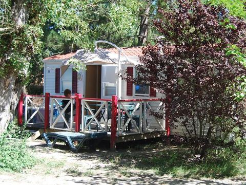 MOBILHOME 4 personnes - Mobil-home Standard Escapade 23m² - 2 chambres + Terrasse avec parasol - 4 pers