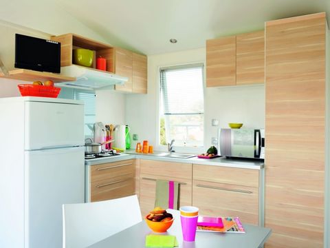 Mobilhome 4 personnes - Confort 26m² - 2 chambres - Terrasse semi couverte - Coté plage