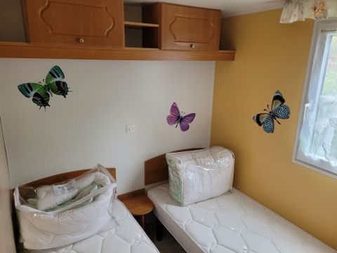 MOBILHOME 4 personnes - Confort Supérieur 4p (32m²) avec terrasse couverte, 2 chambres, climatisé