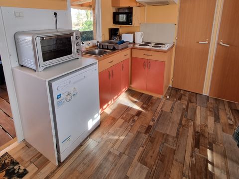 MOBILHOME 6 personnes - 66 Résidence Des Bois 32m2, climatisation + Télevision + lave vaisselle + Terrasse couverte 1/6 pers