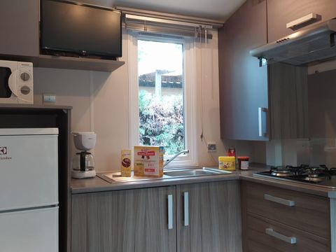 Mobilhome 4 personnes - Loggia Confort 24m² - 2 chambres - Terrasse couverte - Clim - TV