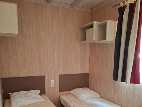 Chalet 6 personnes - Premium 34m² - 3 chambres - Climatisation - Lave-vaisselle - Terrasse couverte