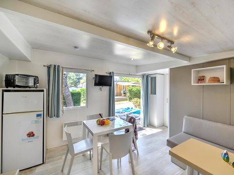 Mobilhome 4 personnes - Bois Confort 30m² - 2 chambres - Terrasse semi-couverte - TV - CLIM