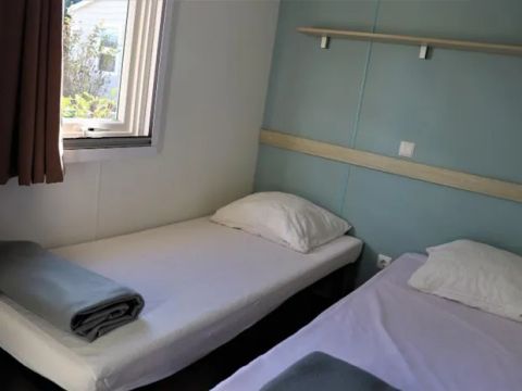 MOBILHOME 4 personnes - Cottage Confort 30m² - (2 chambres) - dont 8m2 de terrasse intégrée + Climatisation + TV 4 pers