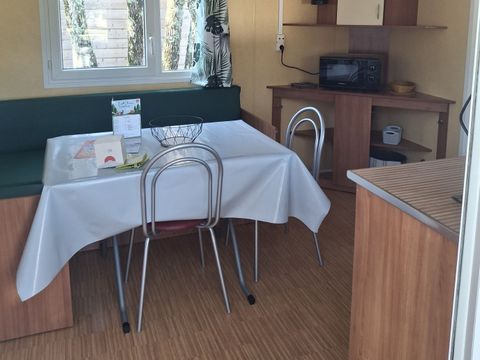 Mobilhome 4 personnes - Confort Climatisation Réversible - Terrasse - 2 chambres - 24m² / Palmier et Olivier