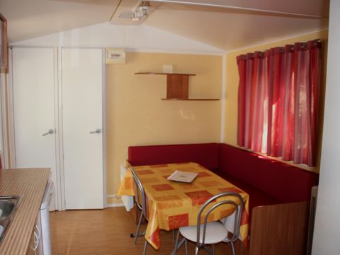 Mobilhome 4 personnes - Confort Climatisation Réversible - Terrasse - 2 chambres - 24m² / Palmier et Olivier
