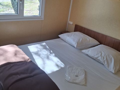 Mobilhome 4 personnes - Confort Climatisation Réversible - Terrasse - 2 chambres - 24m² / Palmier et Olivier