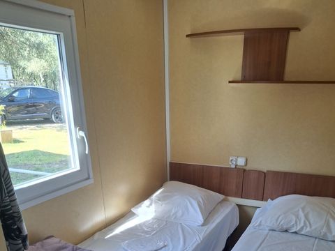 Mobilhome 4 personnes - Confort Climatisation Réversible - Terrasse - 2 chambres - 24m² / Palmier et Olivier