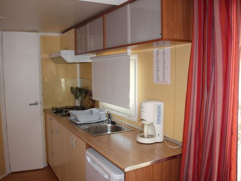 Mobilhome 4 personnes - Confort Climatisation Réversible - Terrasse - 2 chambres - 24m² / Palmier et Olivier