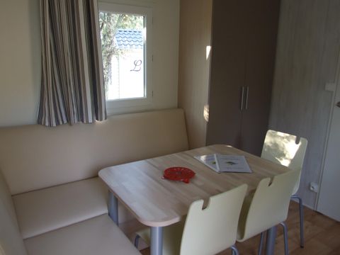 Mobilhome 4 personnes - Confort Climatisation Réversible - Terrasse - 2 chambres - 21m² / Genévrier - Mûrier et Pin d'Alep