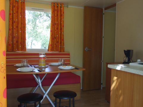 Mobilhome 4 personnes - Sans Sanitaire - Climatisation Réversible - Terrasse - 2 chambres - 18m² / Garrigue