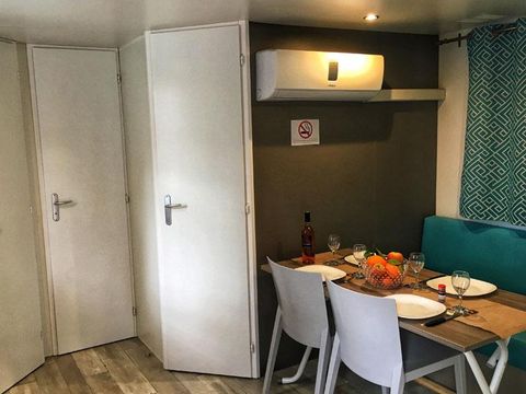 MOBILHOME 4 personnes - Loggia Confort 22m² - 2 chambres + climatisation + TV - dont terrasse semi-couverte de 6m² 4PERS 2/4 pers