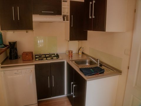 Mobilhome 1/6 personnes - Orchidée Grand Confort 35m² - 2 chambres - Terrasse couverte - CLIM - TV - Lave-vaisselle