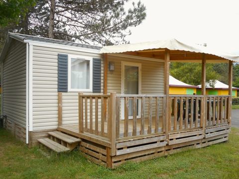 Mobilhome 2 personnes - Confort 21m² - 1 chambre - Terrasse semi-couverte 12m² - TV - Climatisation