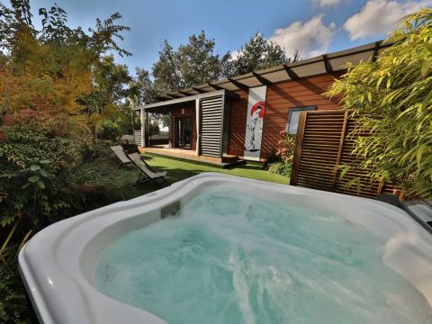 MOBILHOME 4 personnes - Cottage Pagode Premium 3 Pièces 4 Personnes Jacuzzi + Climatisé + TV