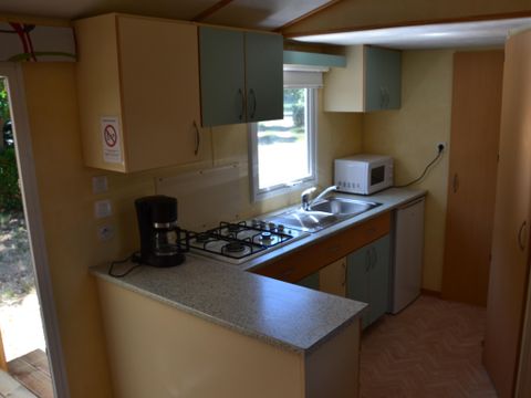 MOBILHOME 4 personnes - Mobil home Confort 2 chambres 28m² + terrasse 9m² + climatisation + TV 4 pers